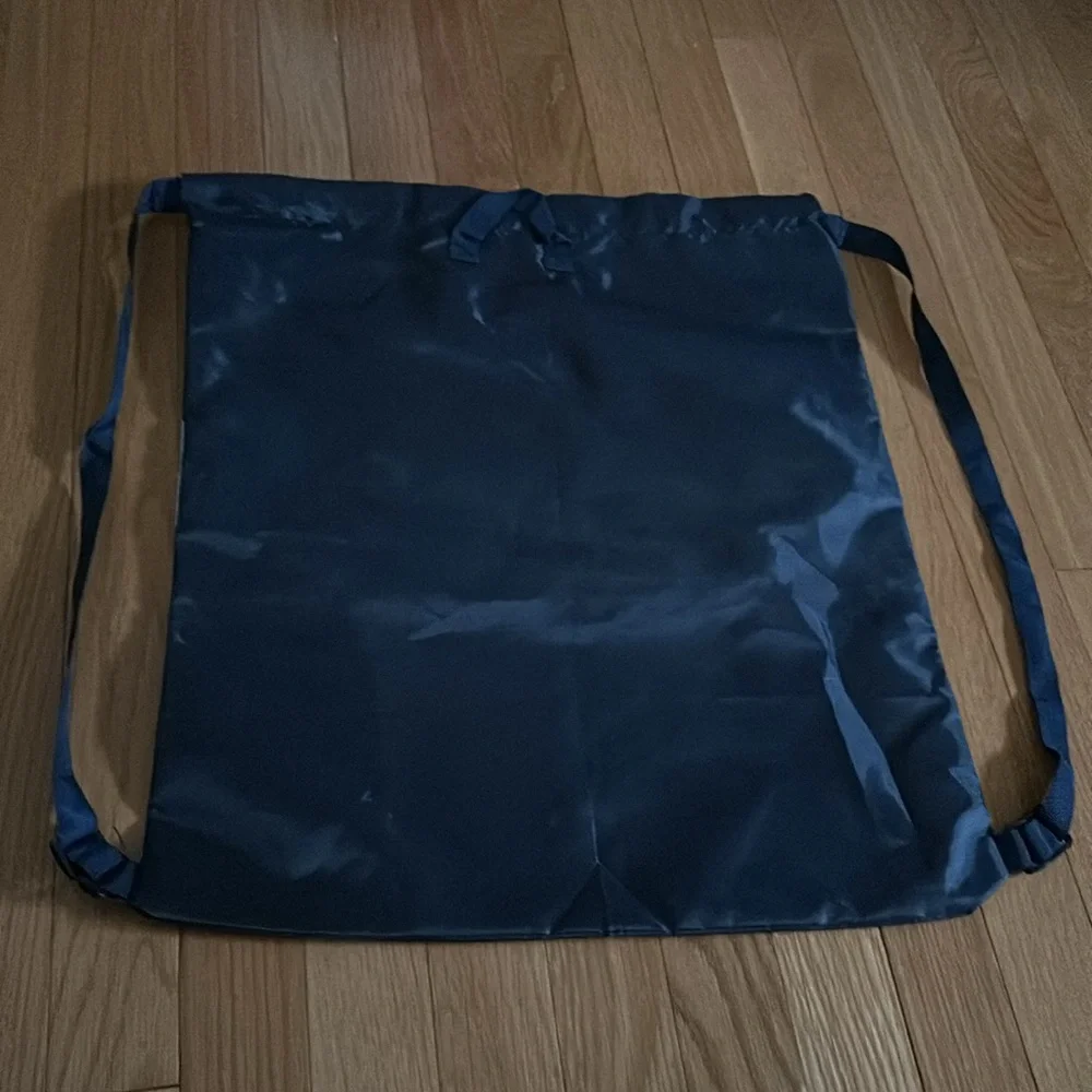 Sketchers navy nylon backpack with straps and hook that anyone can use.